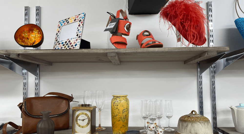 items of homewares and shoes on shop shelf