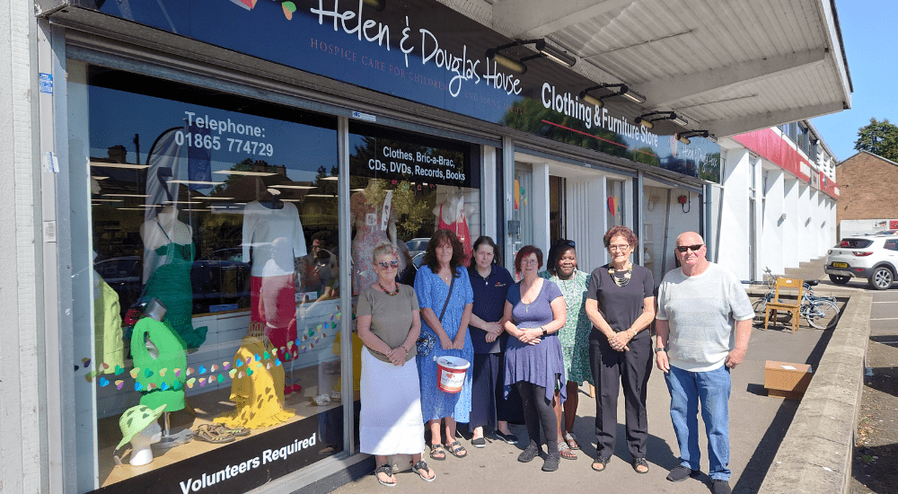 Rose Hill shop front with group of volunteers