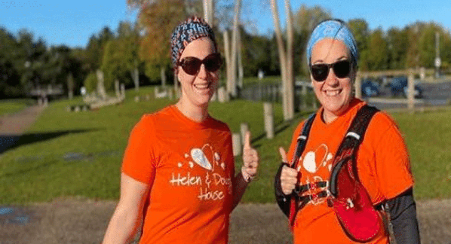 two women with orange HDH tshirts smiling_1500x800