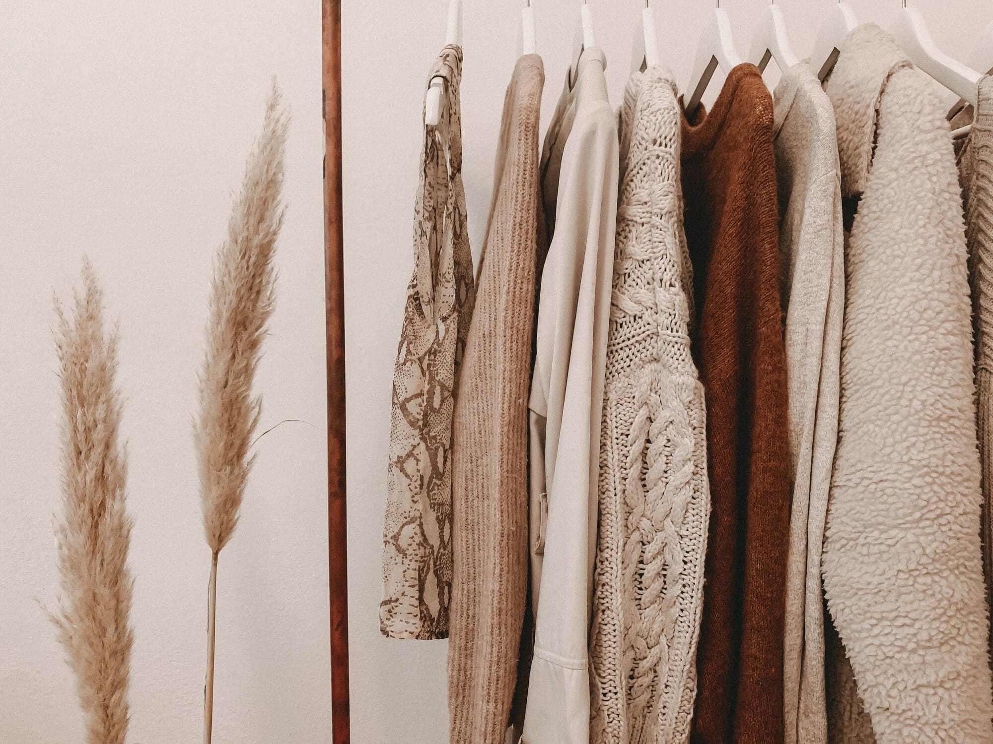 photo of beige clothes on a rail_2000x1500