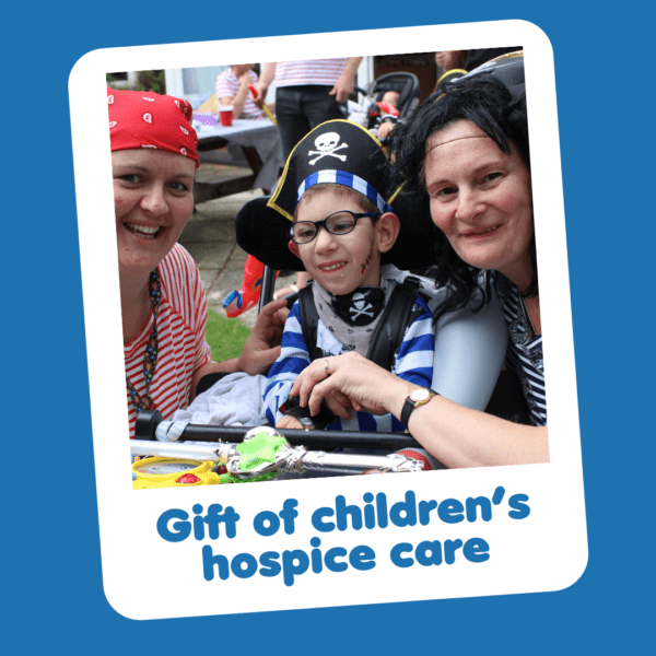 'Gift of children's hospice care' graphic showing a smiley boy dress as a pirate with his mum, part of Charity Gift Cards