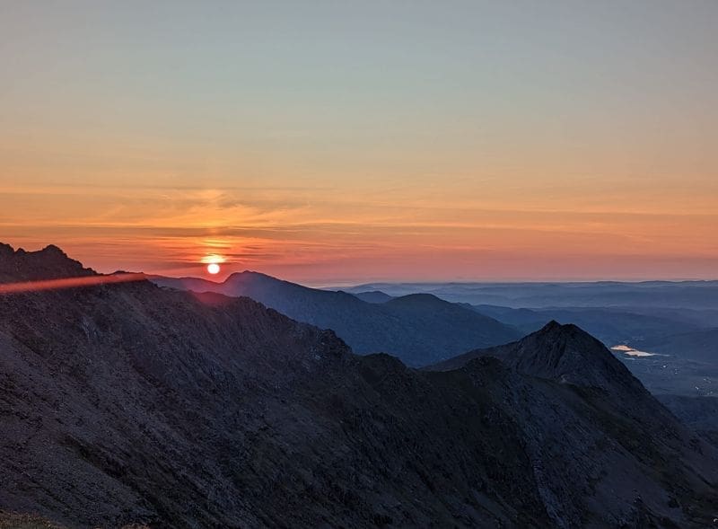 The sun rising over Snowdonia in Wales